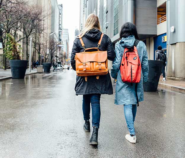 Two students walking down the street